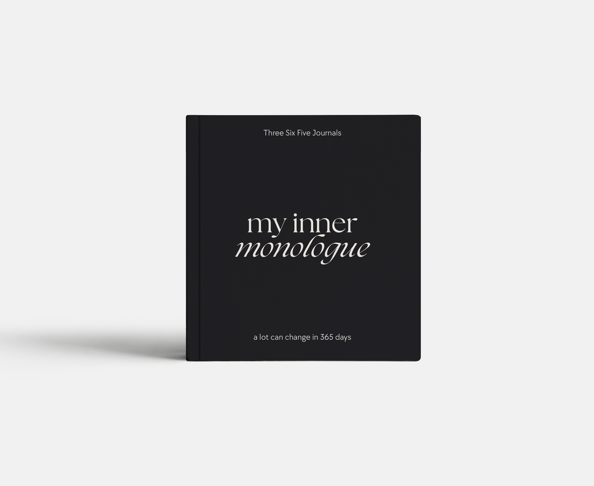 Black journal titled 'my inner monologue' on a white background