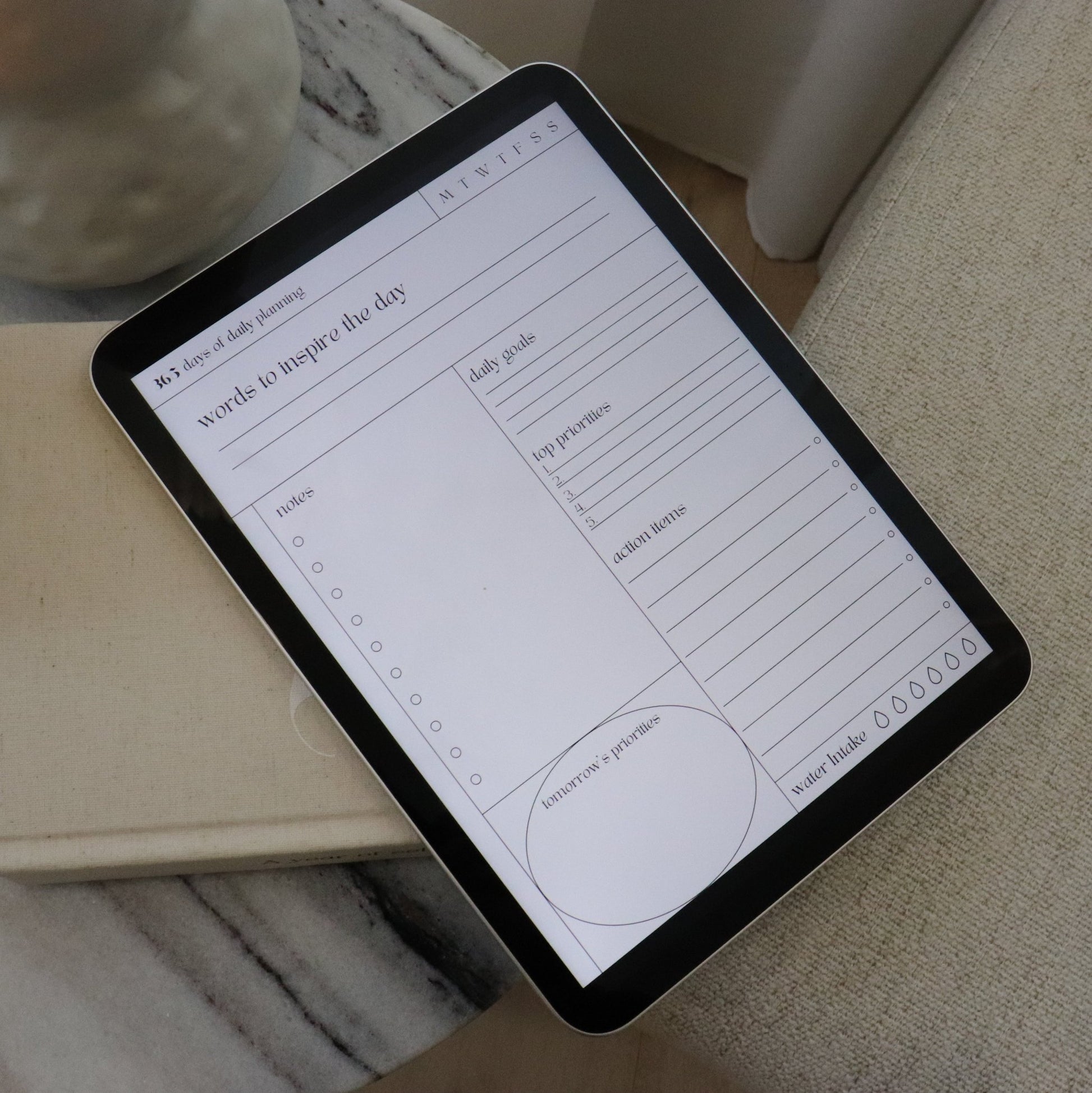 Digital Daily Align Notepad on an iPad on a chair