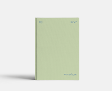 Light green notebook with 'inner' and 'monologue' text on a white background