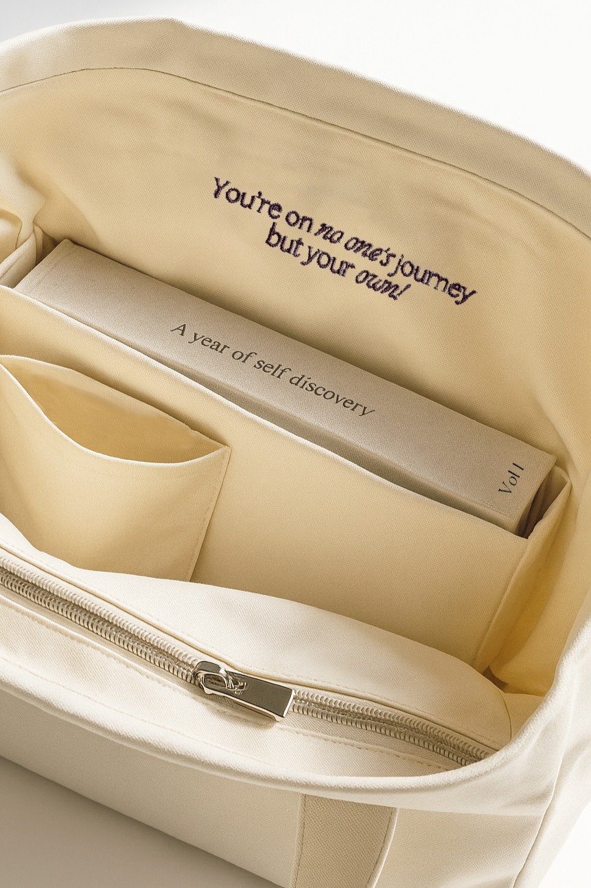 Beige 365 tote with the 365 journal inside, featuring motivational text.